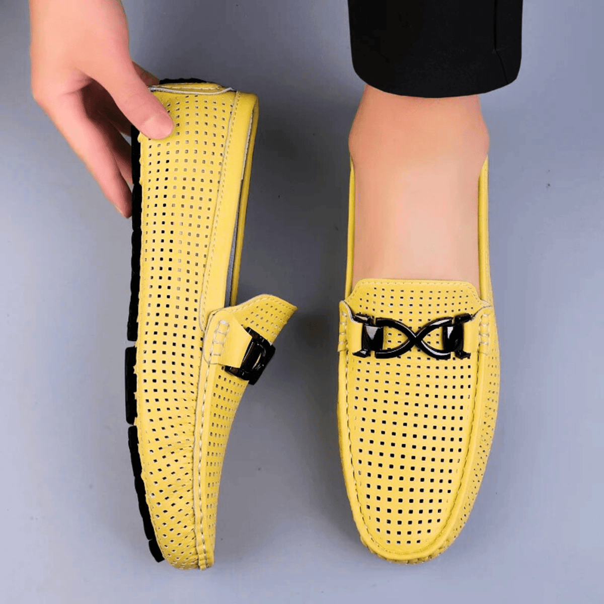 Perforated driving loafer with metal trim and flat treaded sole