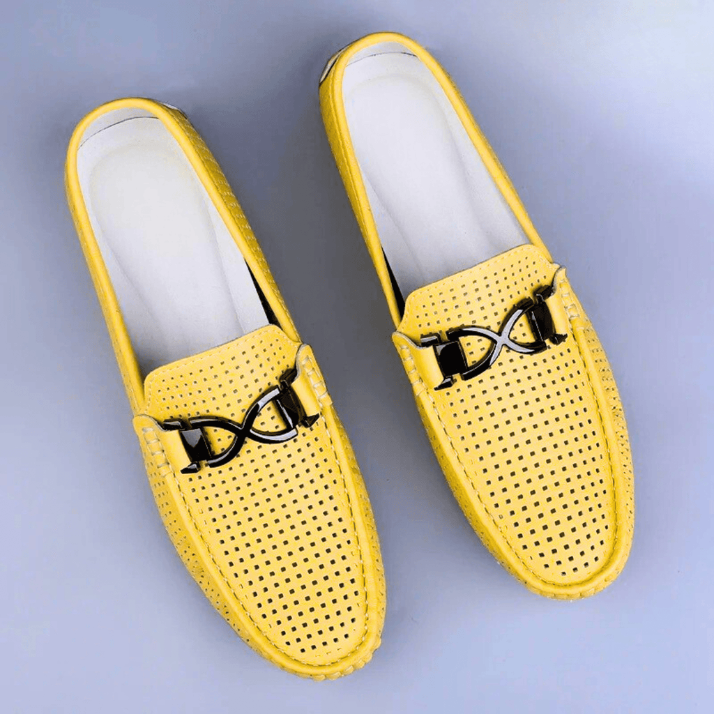 Perforated driving loafer with metal trim and flat treaded sole