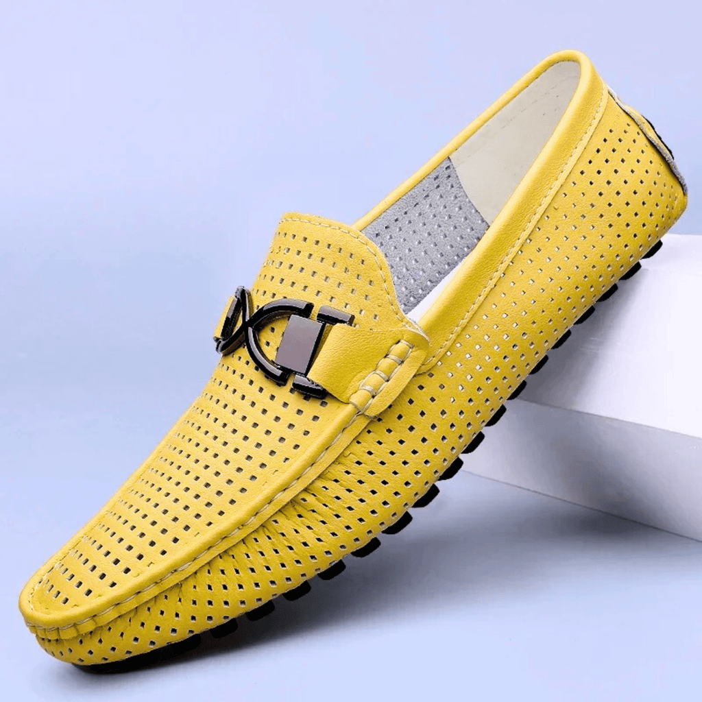 Perforated driving loafer with metal trim and flat treaded sole