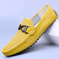 Perforated driving loafer with metal trim and flat treaded sole
