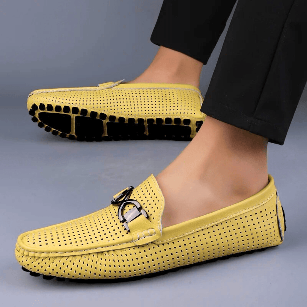 Perforated driving loafer with metal trim and flat treaded sole