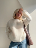 Women's relaxed crew neck jumper with long sleeves and ribbed trims