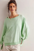 Women's oversized sweatshirt with balloon sleeves, exposed seams and side slits