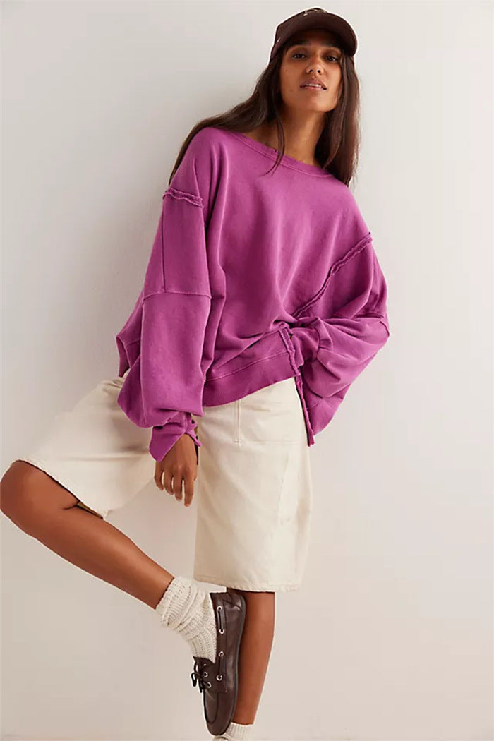 Women's oversized sweatshirt with balloon sleeves, exposed seams and side slits