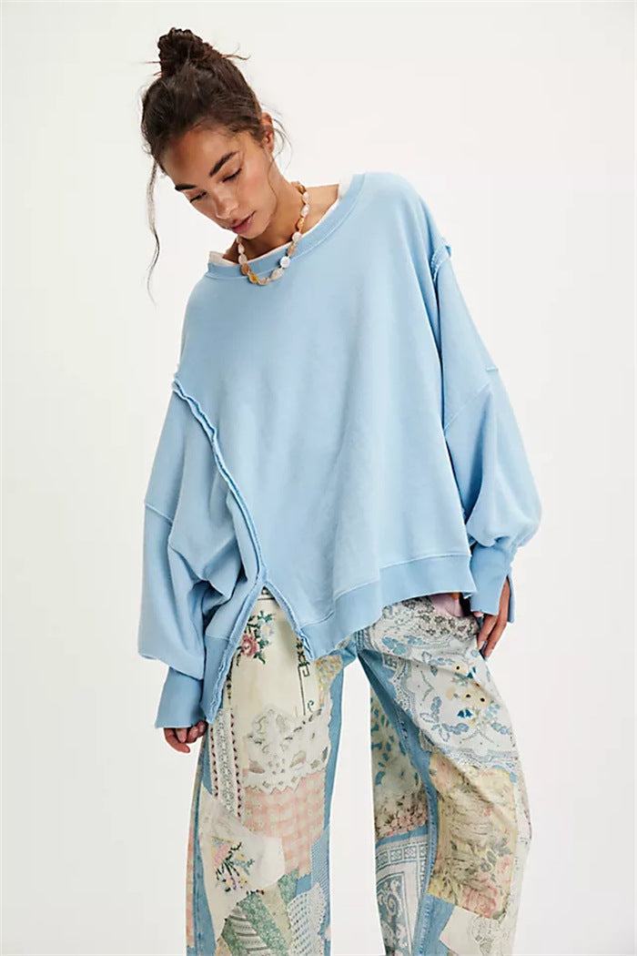 Women's oversized sweatshirt with balloon sleeves, exposed seams and side slits
