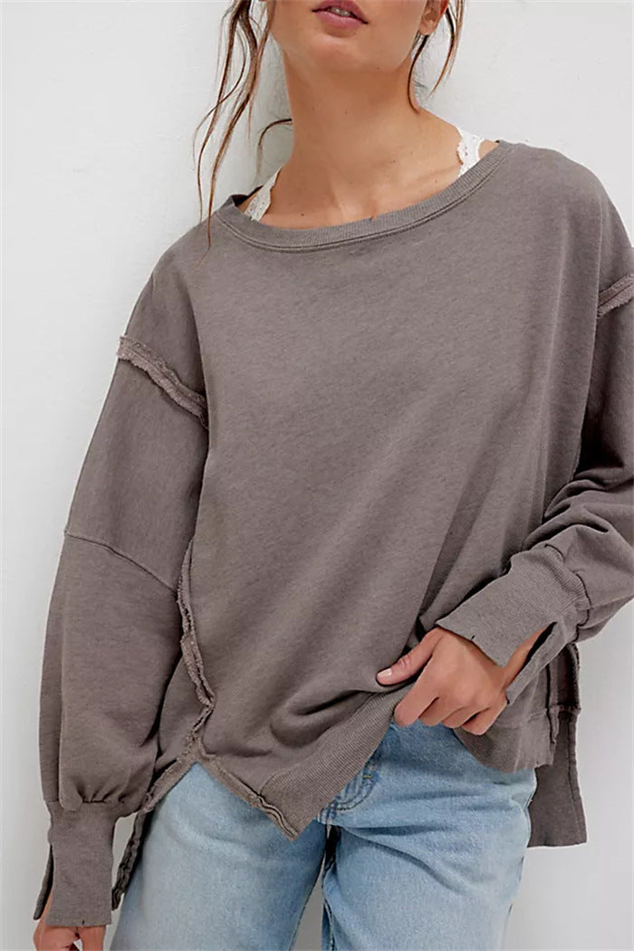 Women's oversized sweatshirt with balloon sleeves, exposed seams and side slits