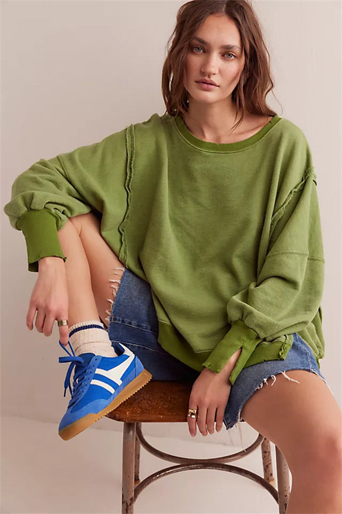 Women's oversized sweatshirt with balloon sleeves, exposed seams and side slits