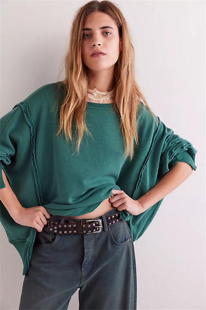 Women's oversized sweatshirt with balloon sleeves, exposed seams and side slits