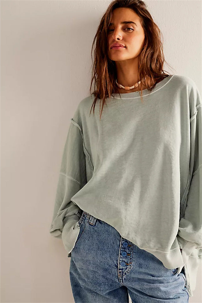 Women's oversized sweatshirt with balloon sleeves, exposed seams and side slits