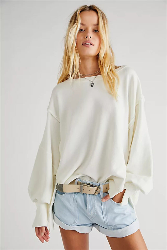 Women's oversized sweatshirt with balloon sleeves, exposed seams and side slits