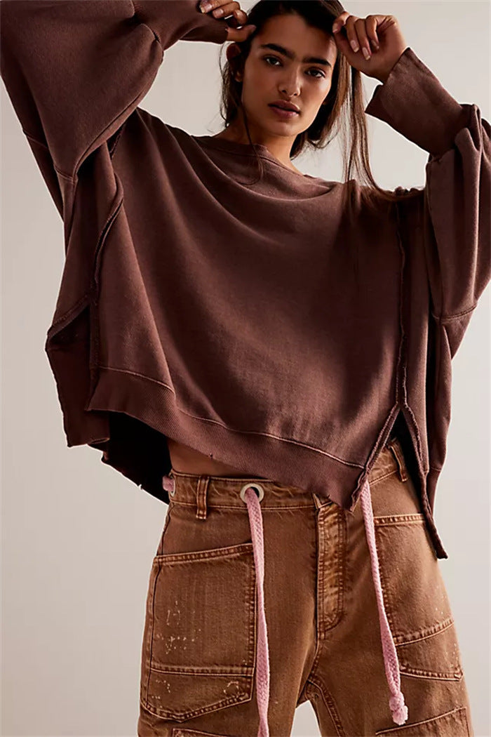 Women's oversized sweatshirt with balloon sleeves, exposed seams and side slits