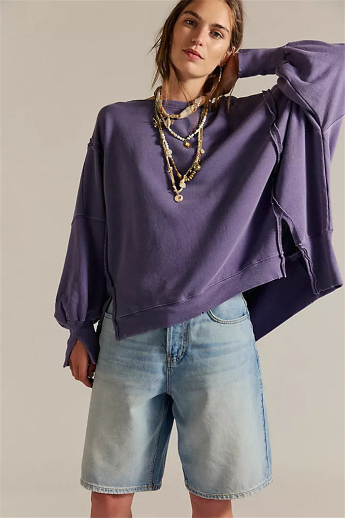 Women's oversized sweatshirt with balloon sleeves, exposed seams and side slits