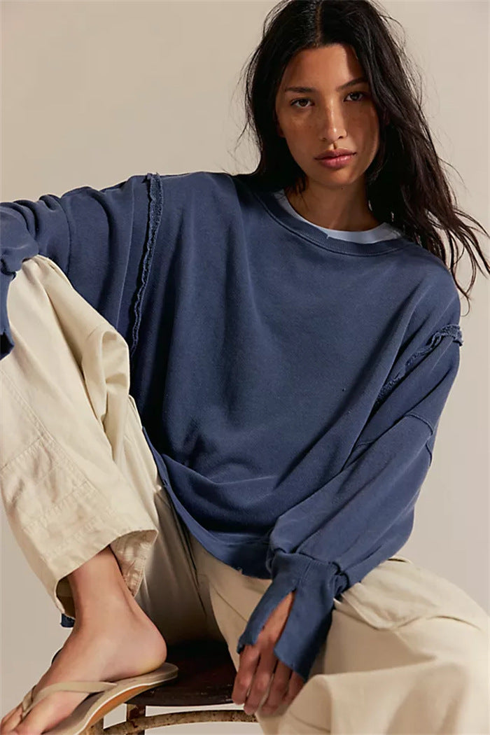 Women's oversized sweatshirt with balloon sleeves, exposed seams and side slits