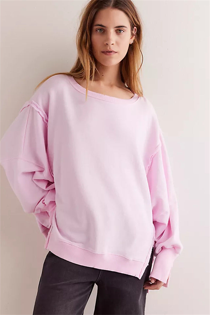Women's oversized sweatshirt with balloon sleeves, exposed seams and side slits