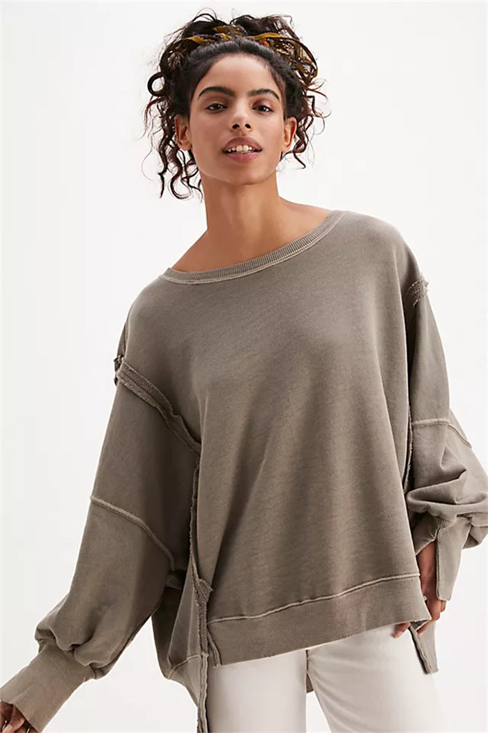 Women's oversized sweatshirt with balloon sleeves, exposed seams and side slits