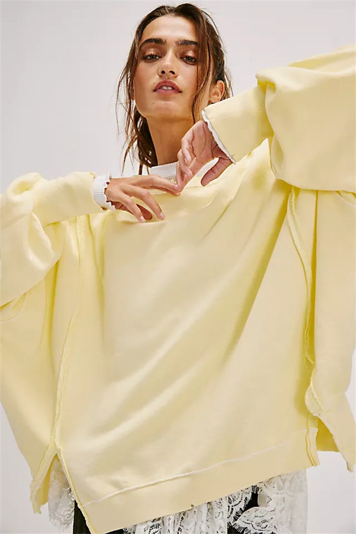 Women's oversized sweatshirt with balloon sleeves, exposed seams and side slits