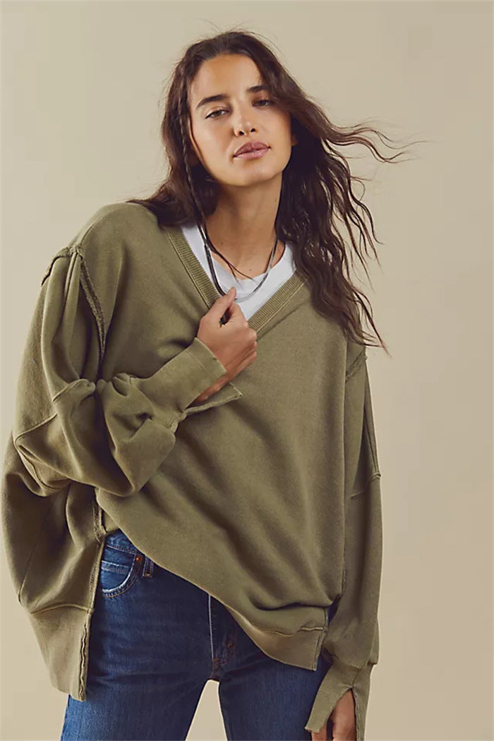 Women's oversized sweatshirt with balloon sleeves, exposed seams and side slits