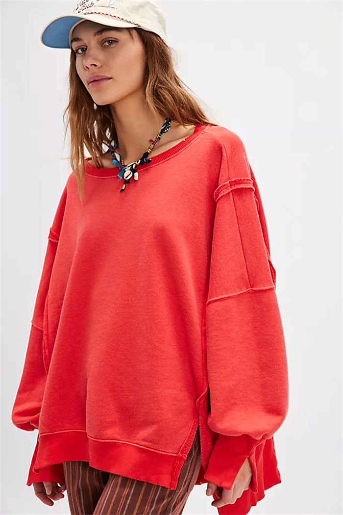 Women's oversized sweatshirt with balloon sleeves, exposed seams and side slits