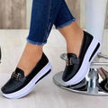 Women's platform loafers with moc toe, metallic buckle trim and raised sole