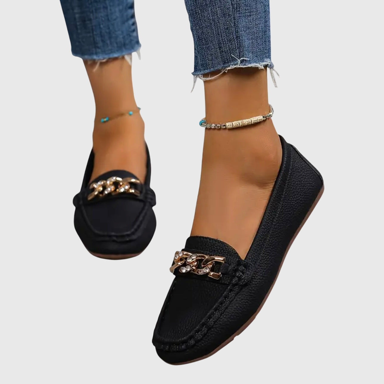 Women's slip-on loafers with rounded toes and decorative chain detail