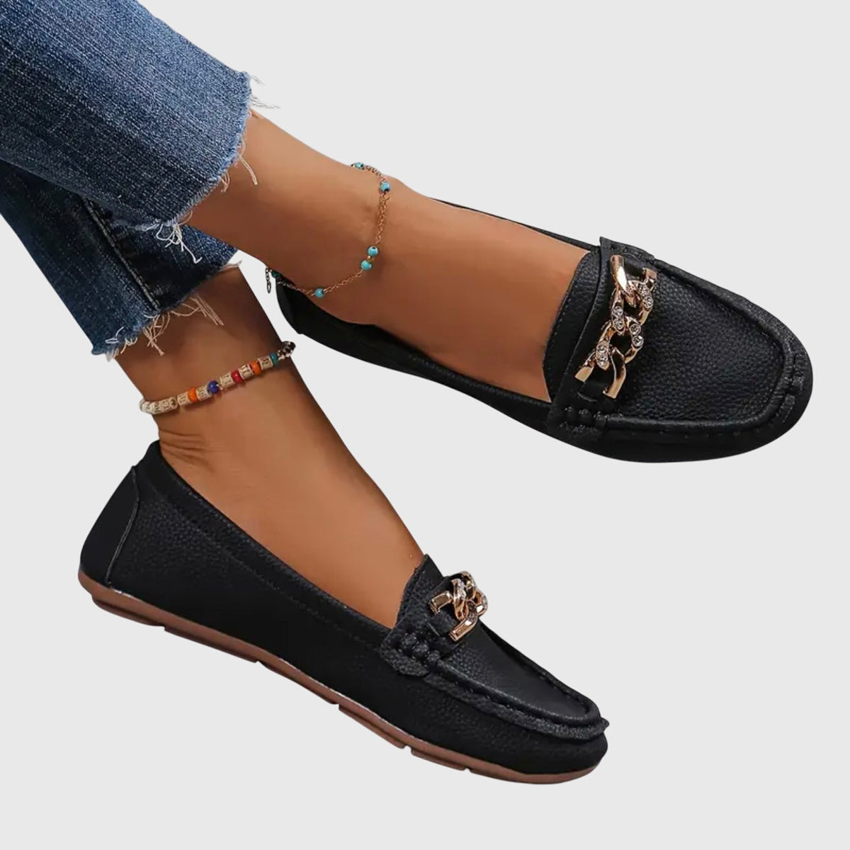 Women's slip-on loafers with rounded toes and decorative chain detail