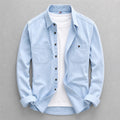 Men's long-sleeved denim shirt with pointed collar and two chest pockets