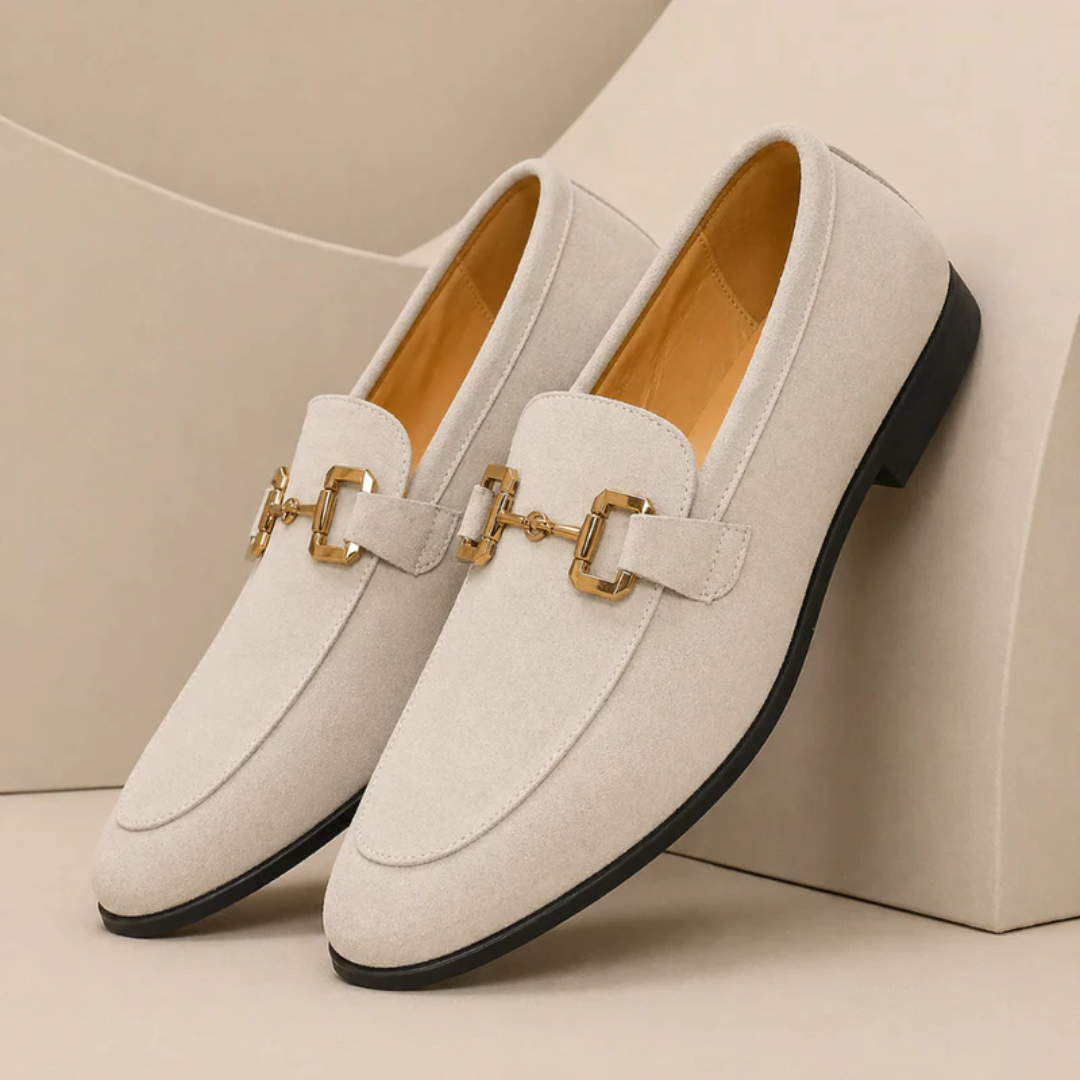 Men's slip-on loafers with decorative buckle and low heel shown in beige and black