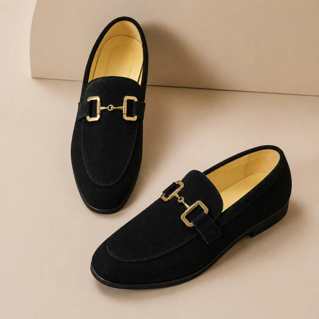 Men's slip-on loafers with decorative buckle and low heel shown in beige and black