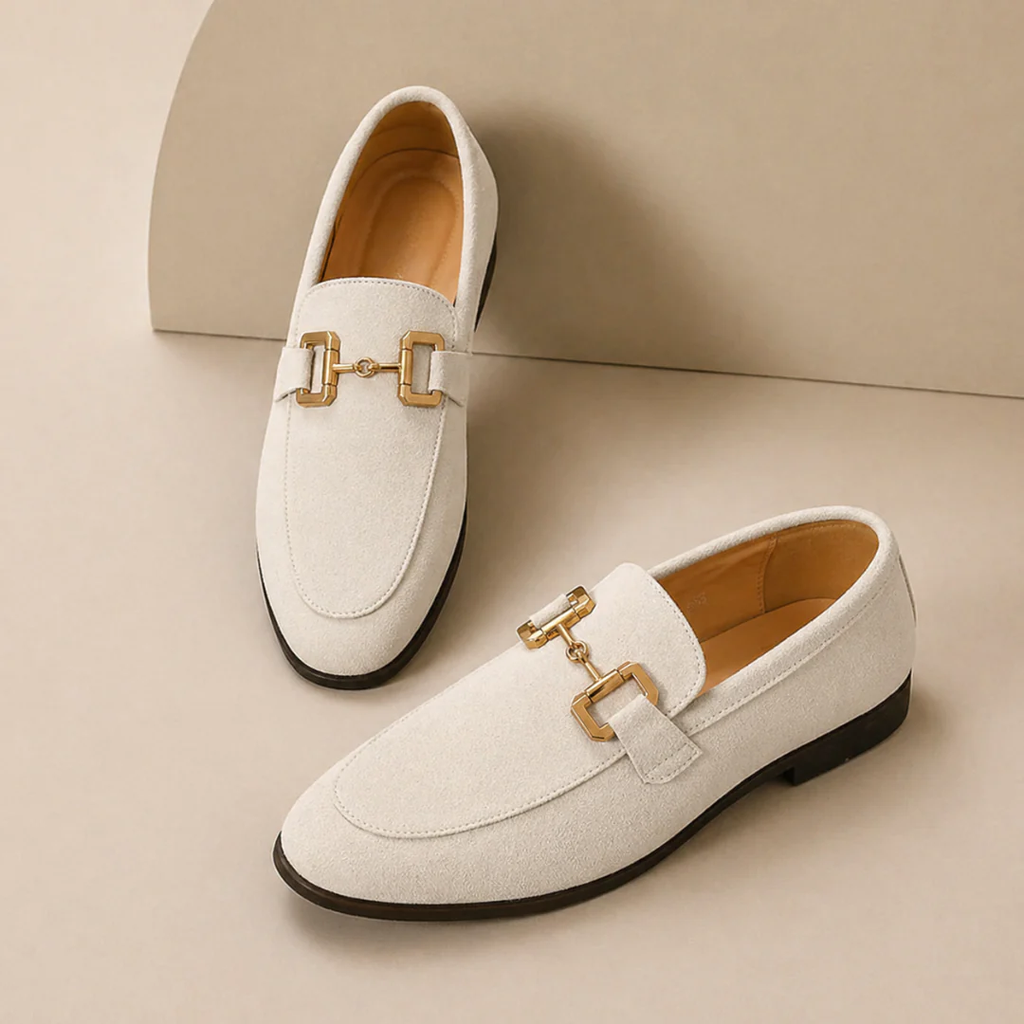 Men's slip-on loafers with decorative buckle and low heel shown in beige and black