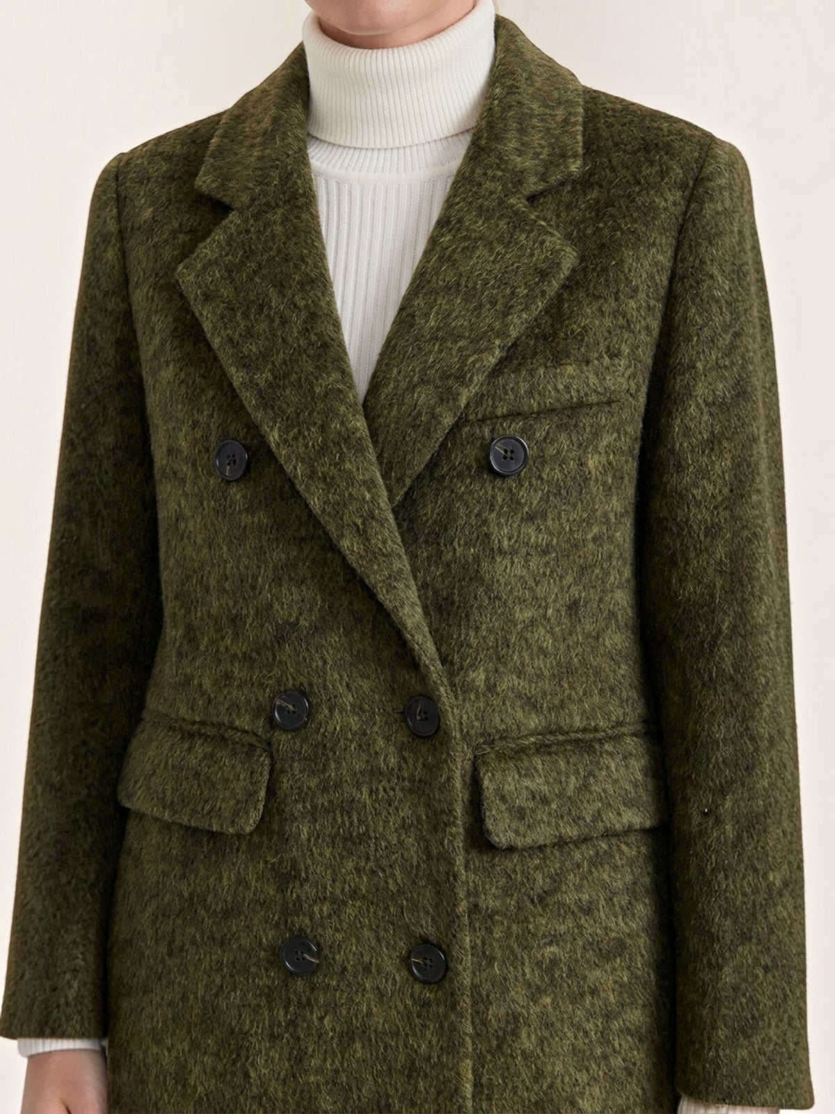 Women's long double-breasted coat with notched lapels and flap pockets