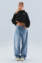 Women's oversized cropped hoodie with hood, long sleeves and printed logo detail