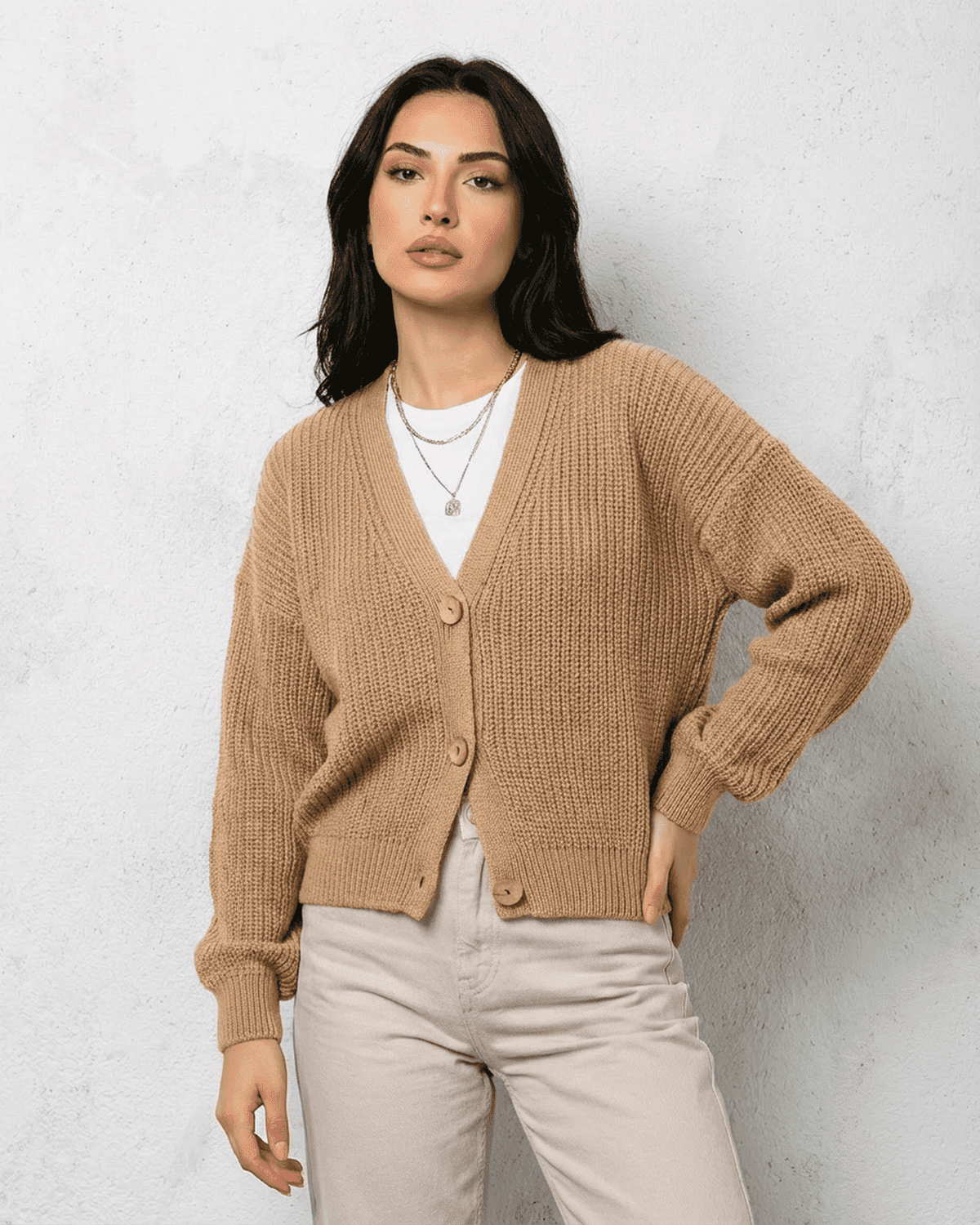 Women's beige ribbed V-neck cardigan with long sleeves and button fastening