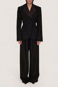 Women's black sculpted blazer with notched lapels and long sleeves