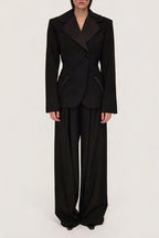 Women's black sculpted blazer with notched lapels and long sleeves
