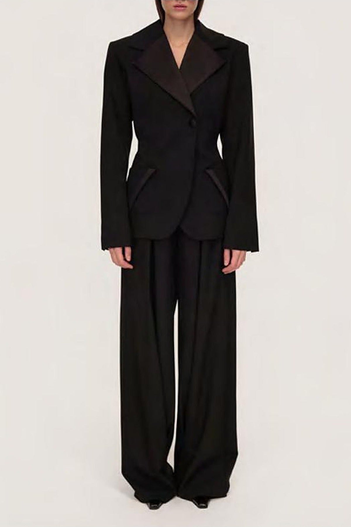 Women's black sculpted blazer with notched lapels and long sleeves