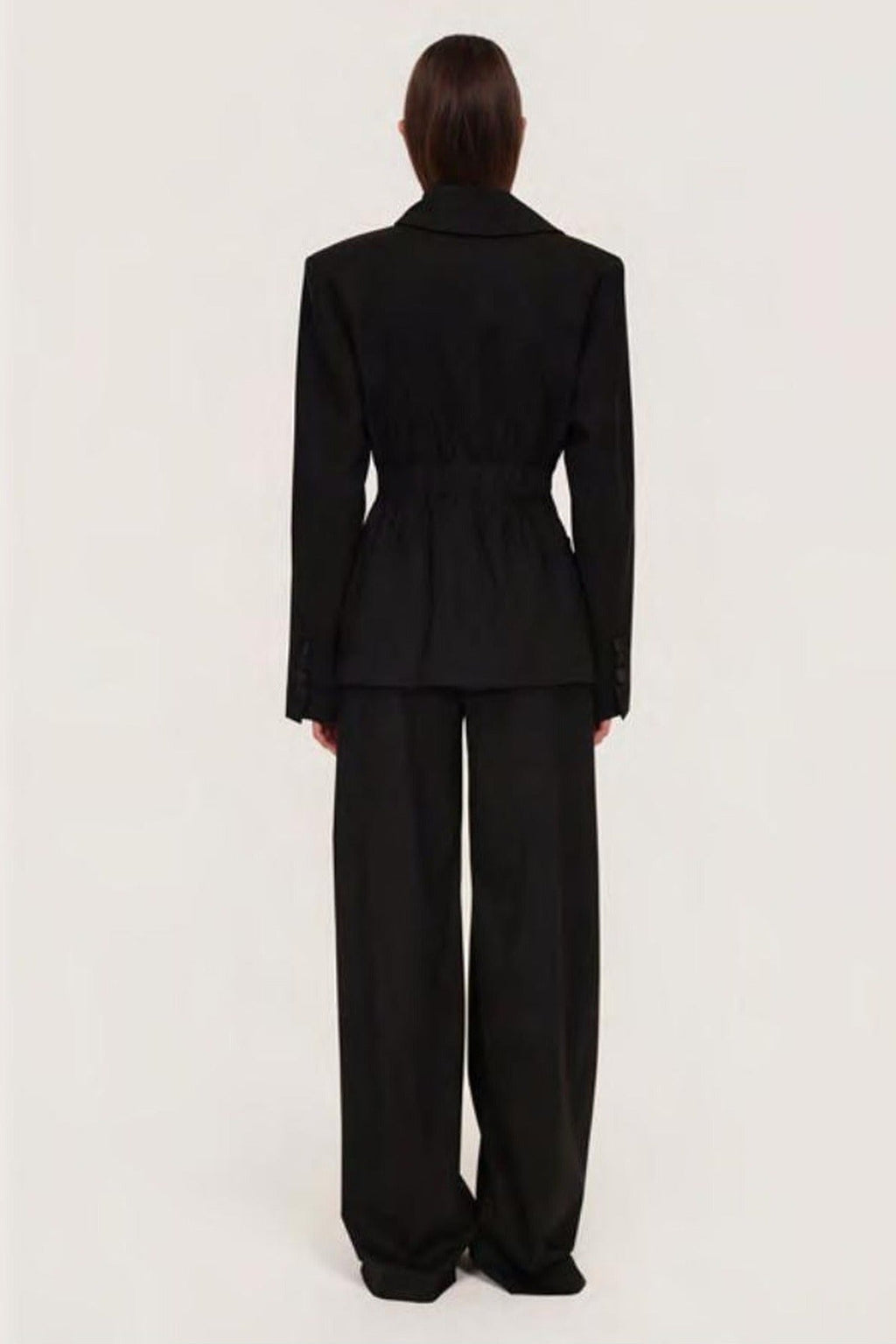 Women's black sculpted blazer with notched lapels and long sleeves