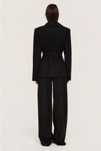 Women's black sculpted blazer with notched lapels and long sleeves