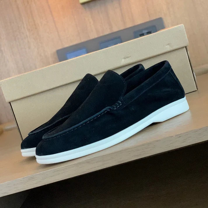 Men's slip-on loafers with moccasin stitching and flat white soles