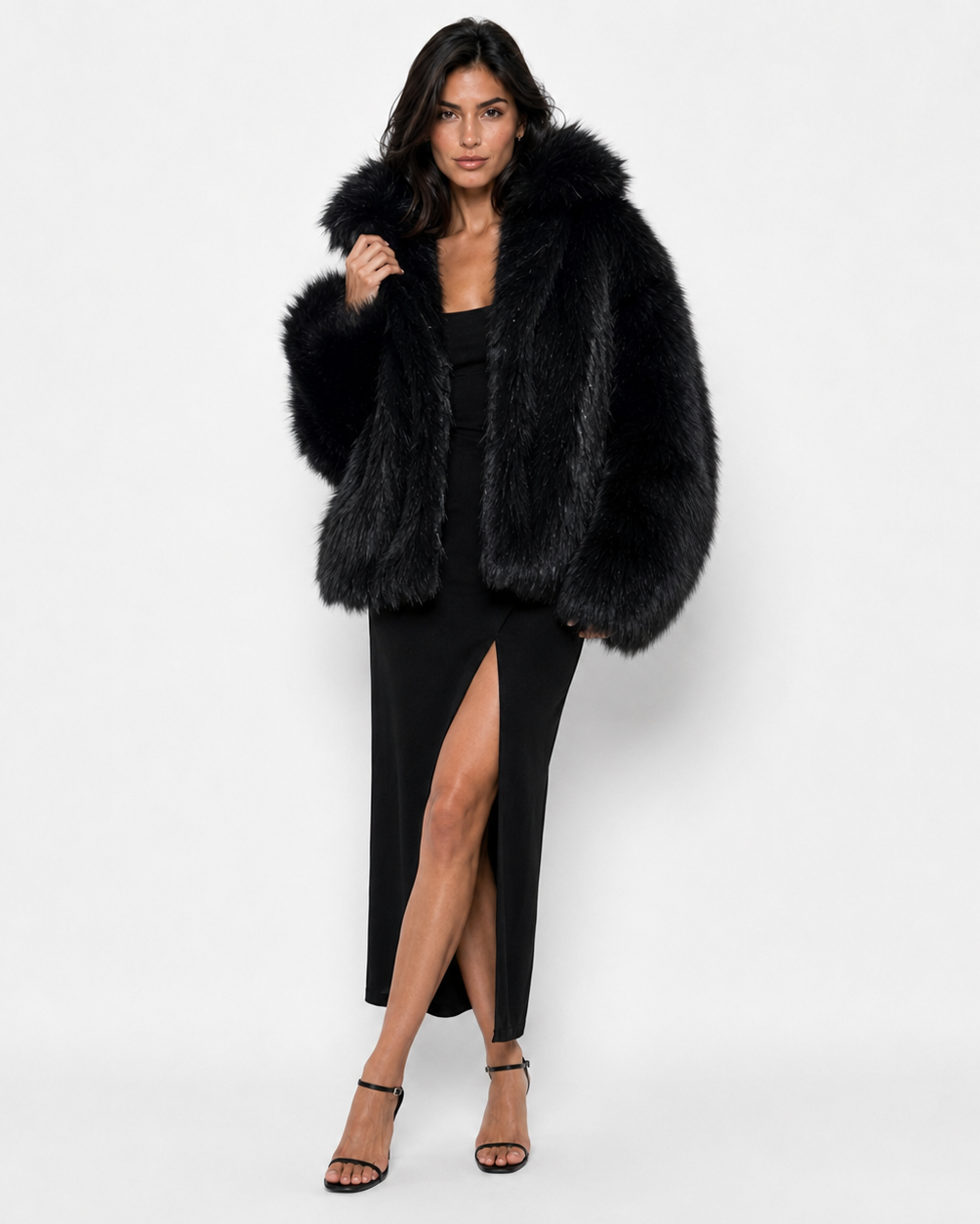 Woman wearing a black long-haired fur coat with a wide collar