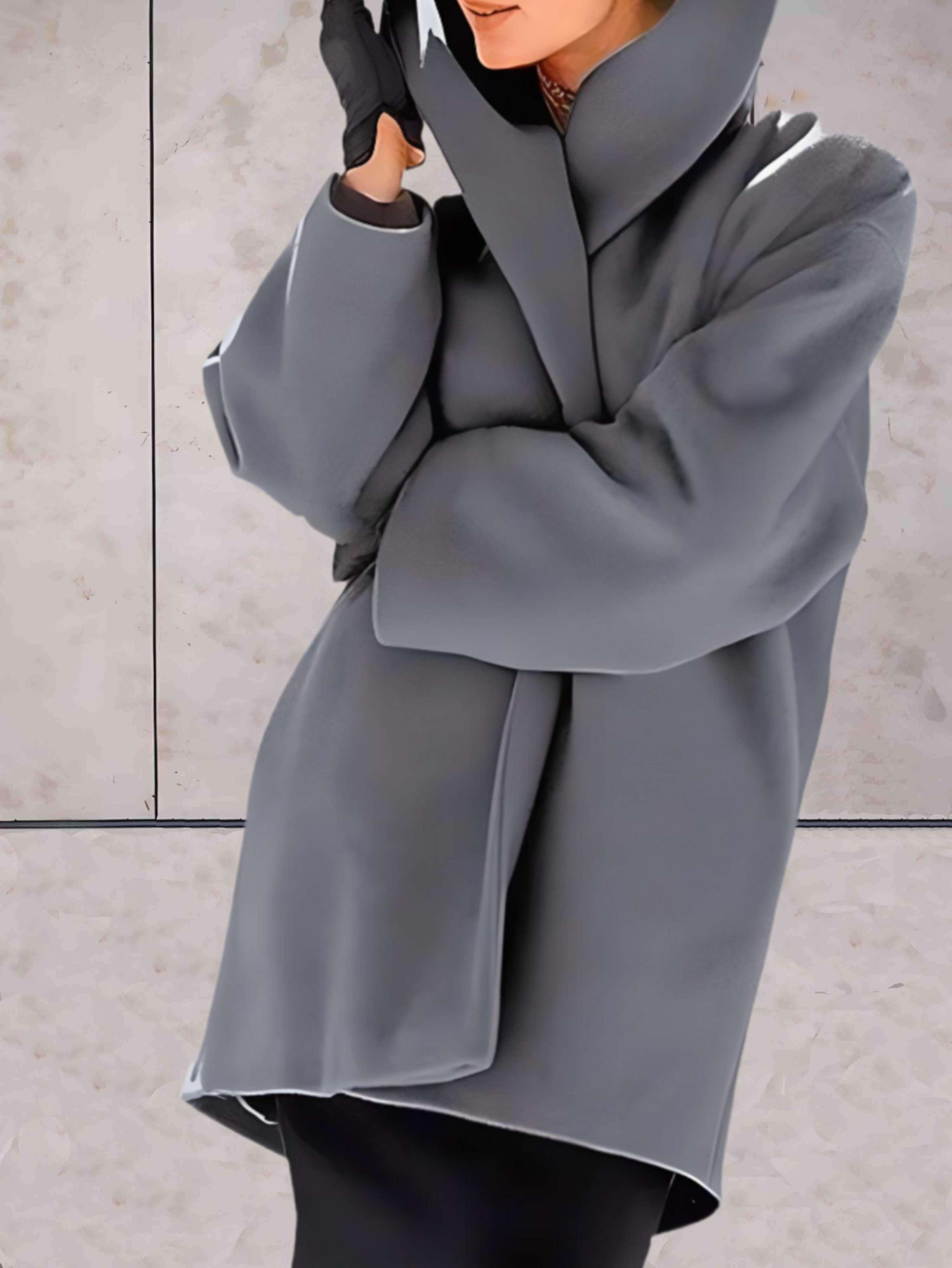 Women's open front winter coat with wide lapels and flared cuffs