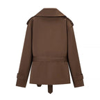 Women's brown cropped trench coat with wide lapels and tie belt