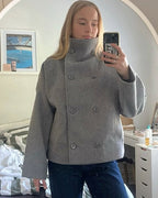 Women's double-breasted stand collar jacket with long sleeves and hip-length cut