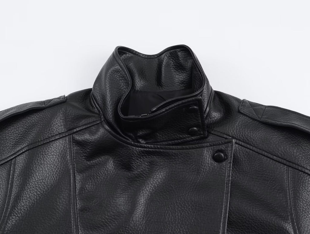 Women's asymmetrical textured jacket with high collar and snap fastening