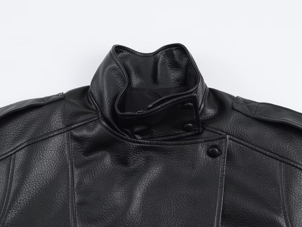 Women's asymmetrical textured jacket with high collar and snap fastening