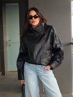 Women's asymmetrical jacket with high collar, long sleeves and diagonal front fastening