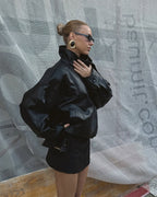 Women's asymmetrical jacket with high collar, long sleeves and diagonal front fastening