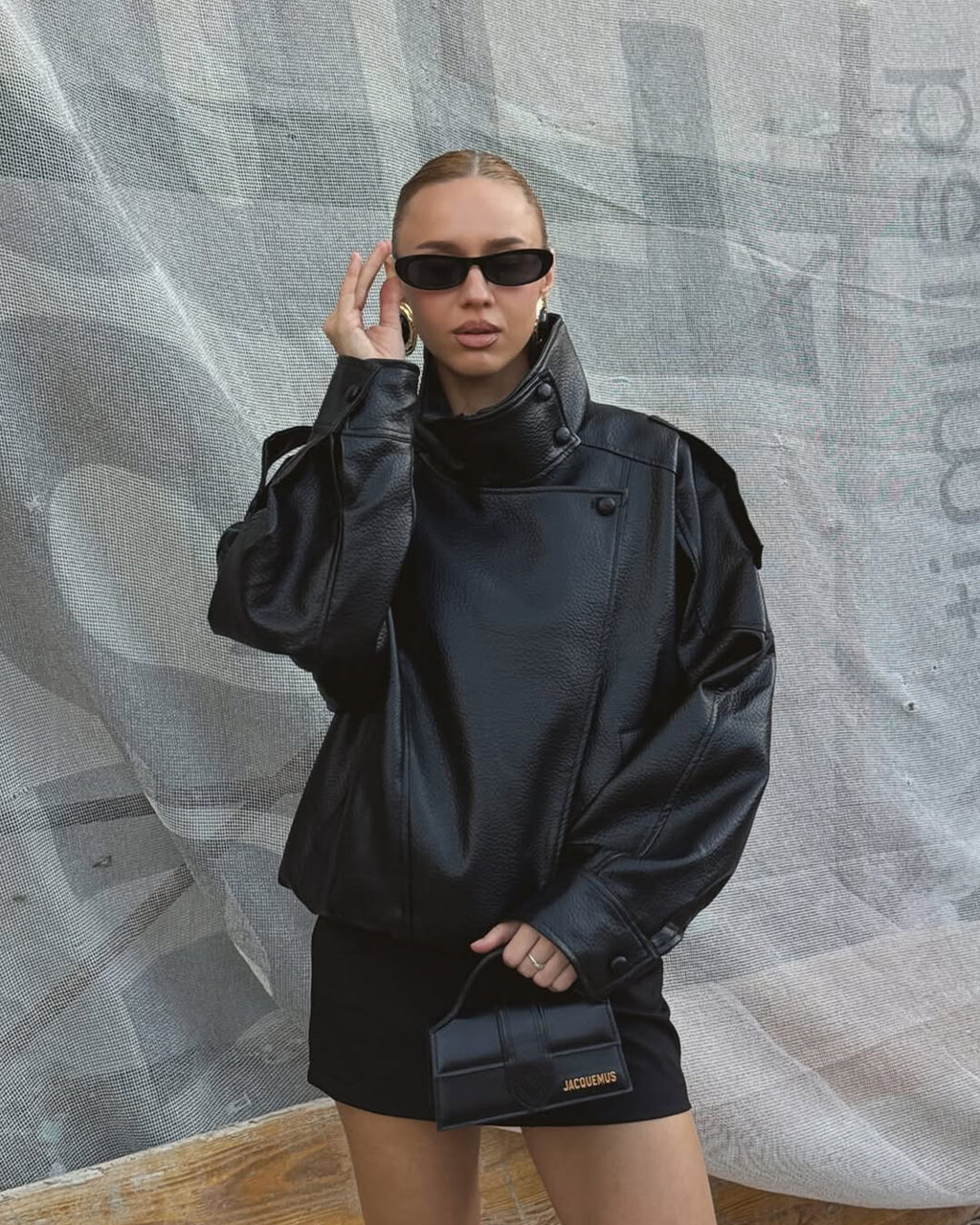 Women's asymmetrical jacket with high collar, long sleeves and diagonal front fastening