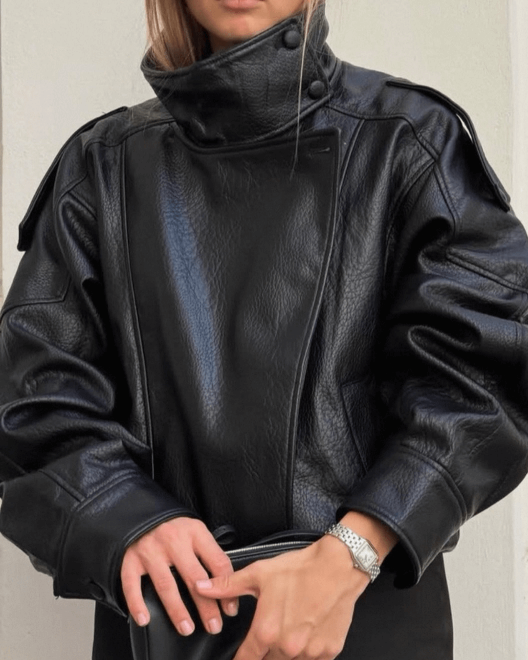 Women's asymmetrical jacket with high collar, long sleeves and diagonal front fastening