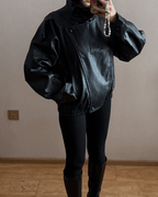 Women's asymmetrical jacket with high collar, long sleeves and diagonal front fastening