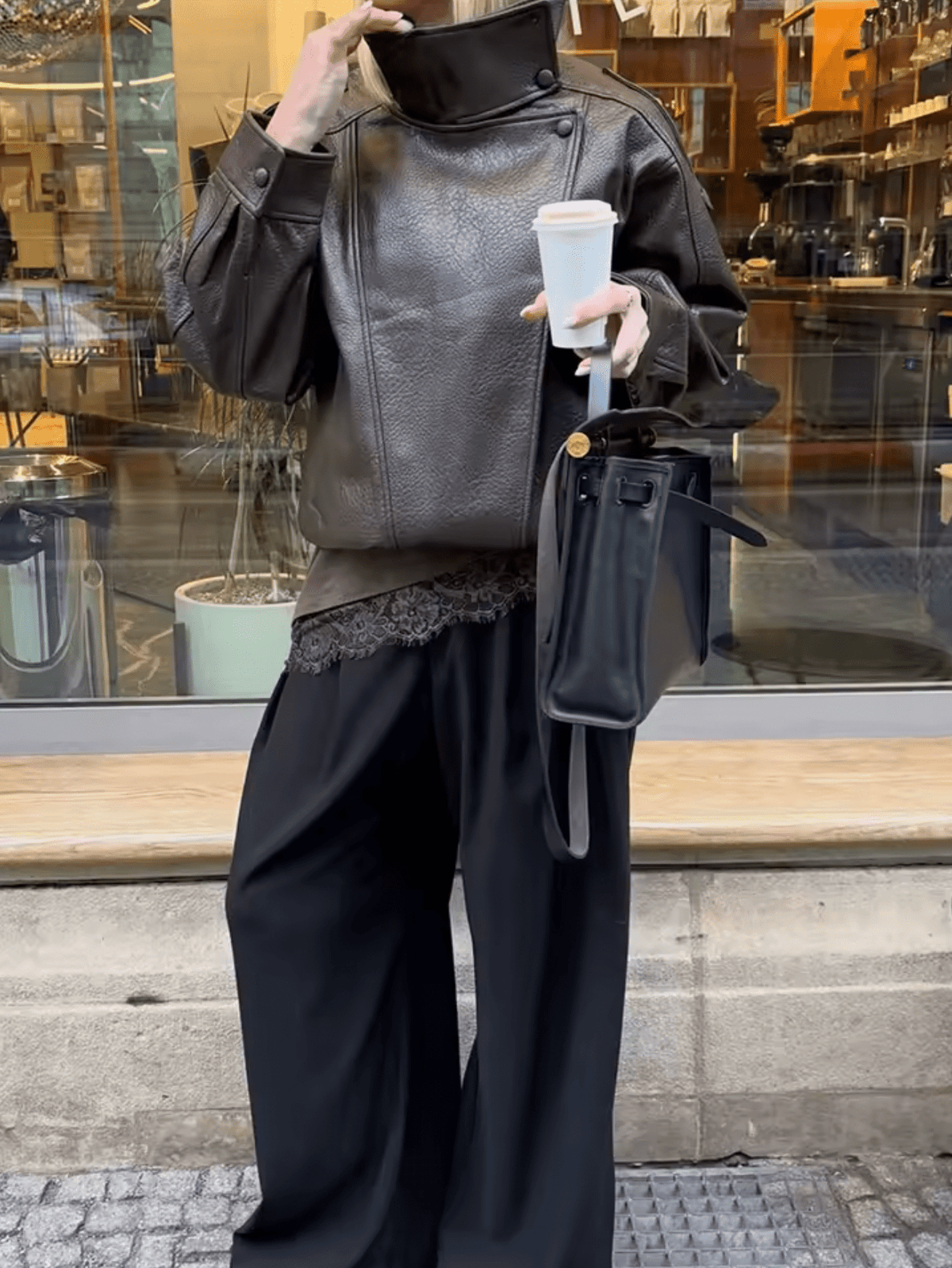 Women's asymmetrical jacket with high collar, long sleeves and diagonal front fastening